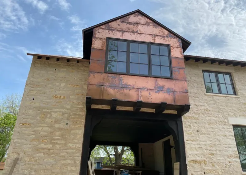 Copper metal panel facade on a stone building for Metal Roof Coating in Jonesborough